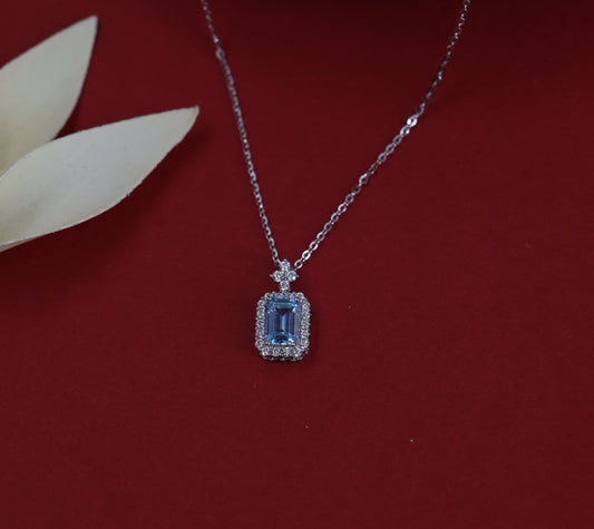 Elegant Blue Topaz Halo Necklace